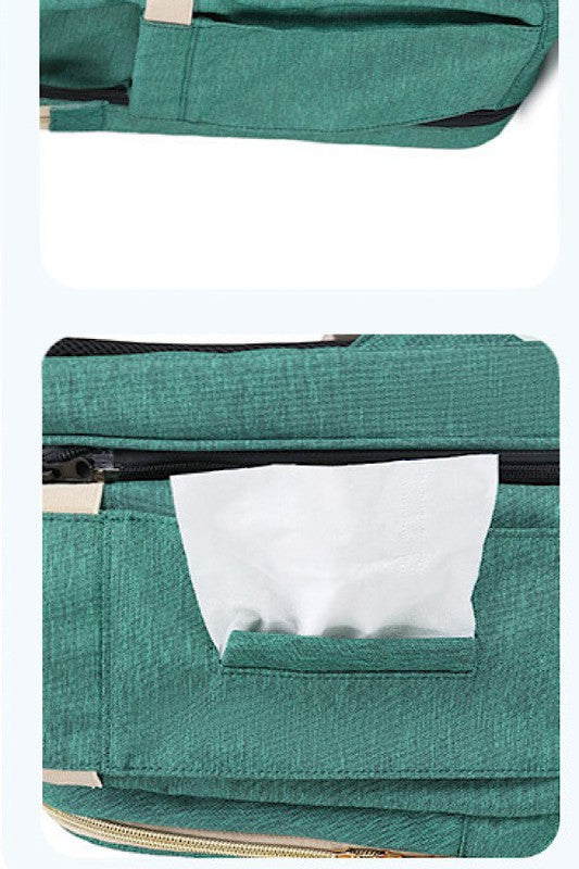 Diaper bag w/ portable baby nap bed