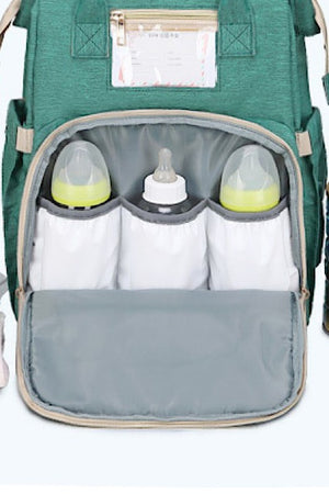 Diaper bag w/ portable baby nap bed