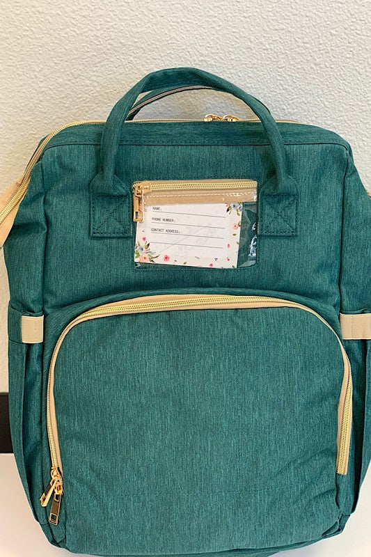 Diaper bag w/ portable baby nap bed