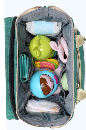 Diaper bag w/ portable baby nap bed